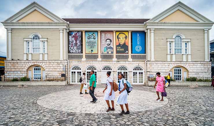 A photo of pedestrians passing by the Montego Bay Cultural Center in  Montego Bay, Jamaica.